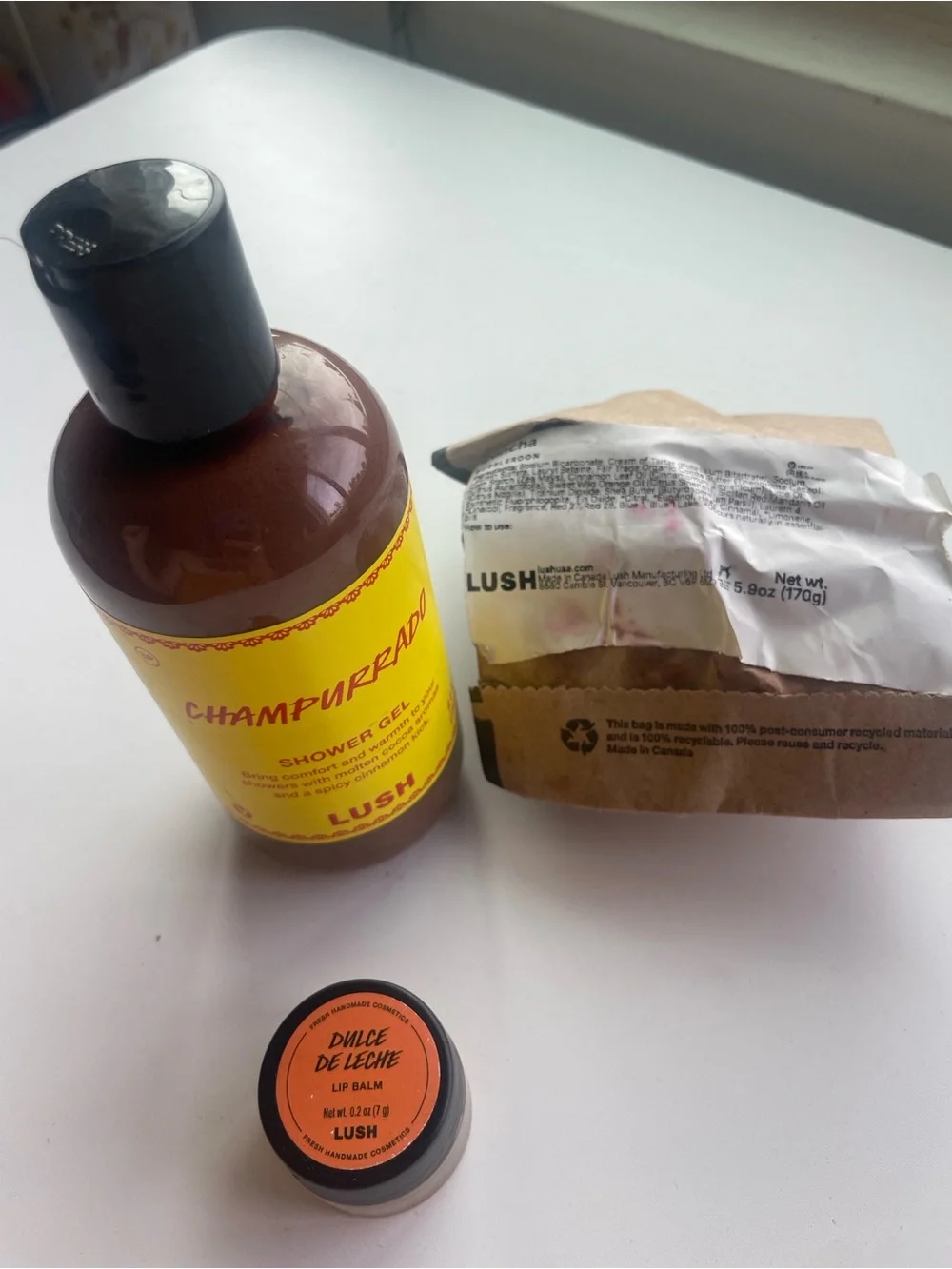 LUSH Yellow Champurrado Shower Gel & Dulce de Leche Lip Balm - Concha Bath Bom